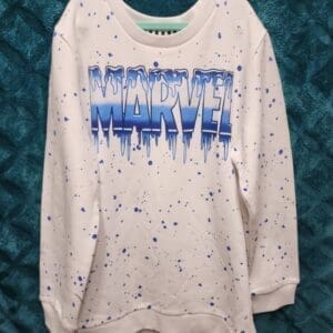 A white sweatshirt with blue and purple paint splashing on it.