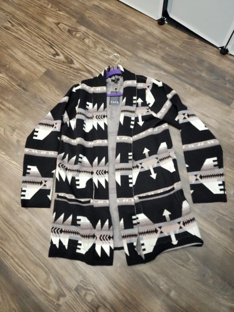 A black and white sweater with bears on it